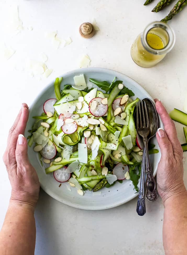 Shaved Zucchini Asparagus Salad loaded with raw greens, radishes, almonds & parmesan then tossed with a Lemon Vinaigrette. This light summer salad focuses on real ingredients and bringing out complex flavors!