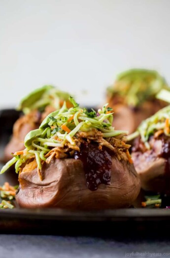 30 Minute BBQ Chicken Stuffed Sweet Potatoes topped with Broccoli Slaw. These Stuffed Sweet Potatoes are an easy gluten free recipe that's perfect for a quick weeknight dinner!