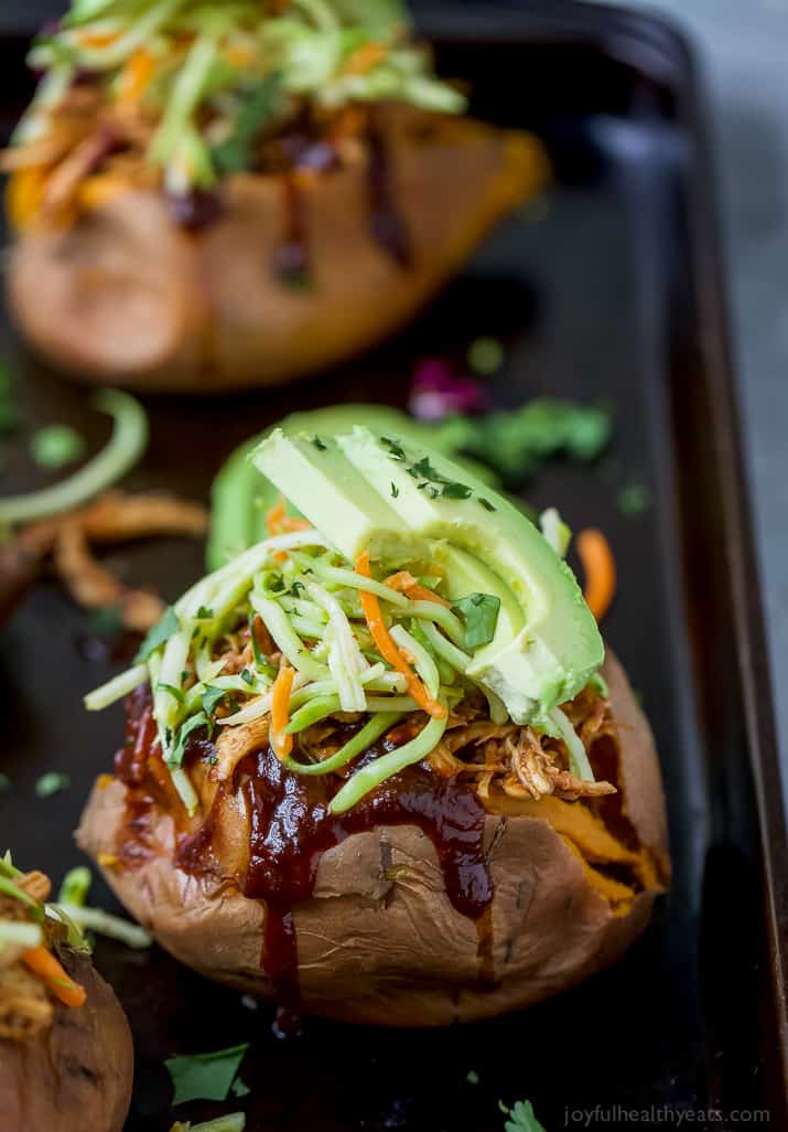 BBQ Chicken Stuffed Sweet Potatoes topped with Broccoli Slaw and avocado slices