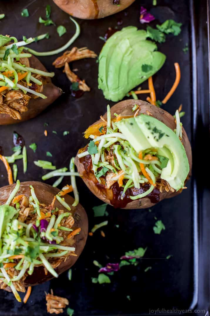 BBQ Chicken Stuffed Sweet Potatoes topped with Broccoli Slaw and sliced avocado