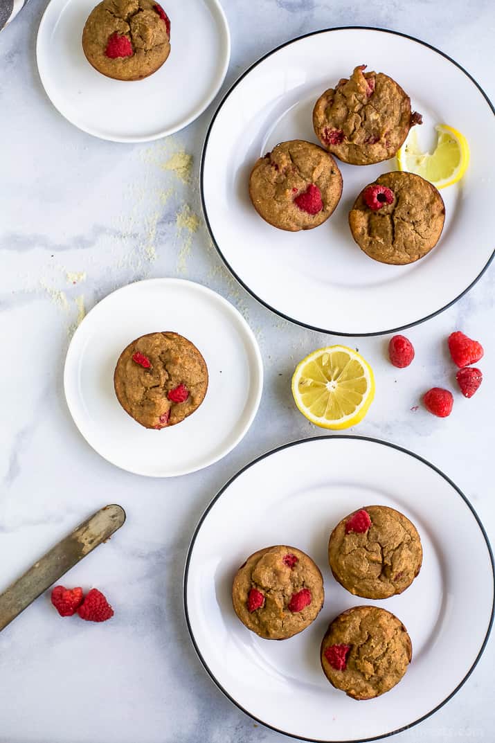 Flourless Lemon Raspberry Protein Muffins with 9 grams of protein per muffin! These berry bursting sugar free muffins are the perfect quick breakfast or post workout snack!