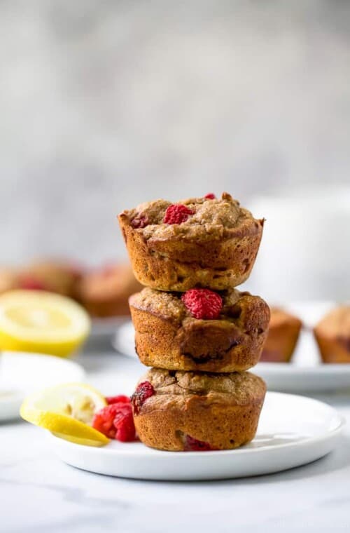Flourless Lemon Raspberry Protein Muffins with 9 grams of protein per muffin! These berry bursting sugar free muffins are the perfect quick breakfast or post workout snack!