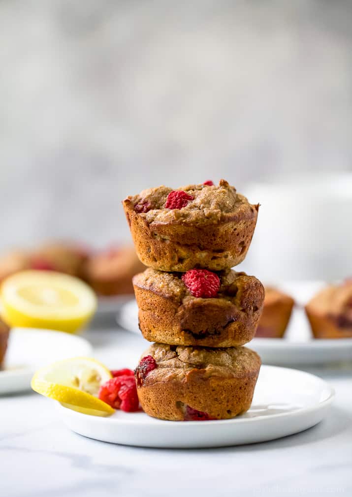 Flourless Lemon Raspberry Protein Muffins with 9 grams of protein per muffin! These berry bursting sugar free muffins are the perfect quick breakfast or post workout snack!