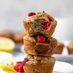 lemon raspberry protein muffins piled on top of one another