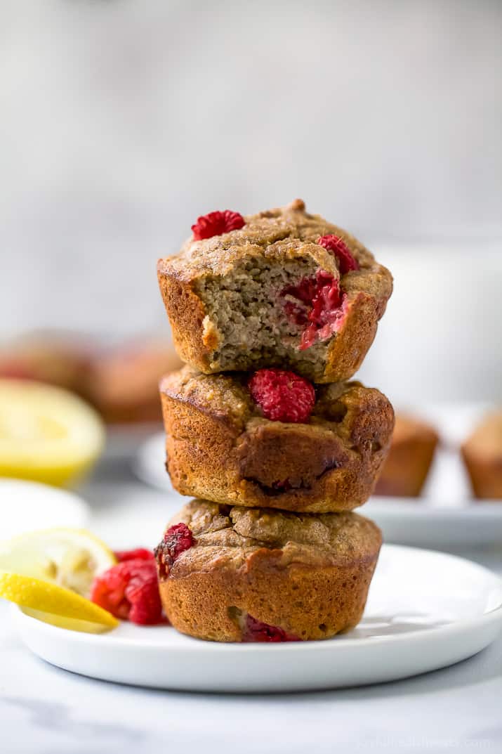 Flourless Lemon Raspberry Protein Muffins with 9 grams of protein per muffin! These berry bursting sugar free muffins are the perfect quick breakfast or post workout snack!