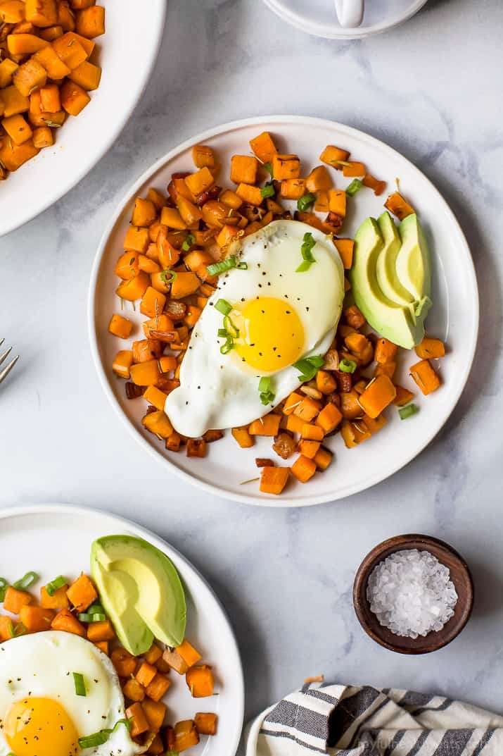 30 Minute Paleo Sweet Potato Hash & Eggs with bacon and avocado. A quick easy breakfast hash that's under 350 calories and so delicious you'll want to devour it!