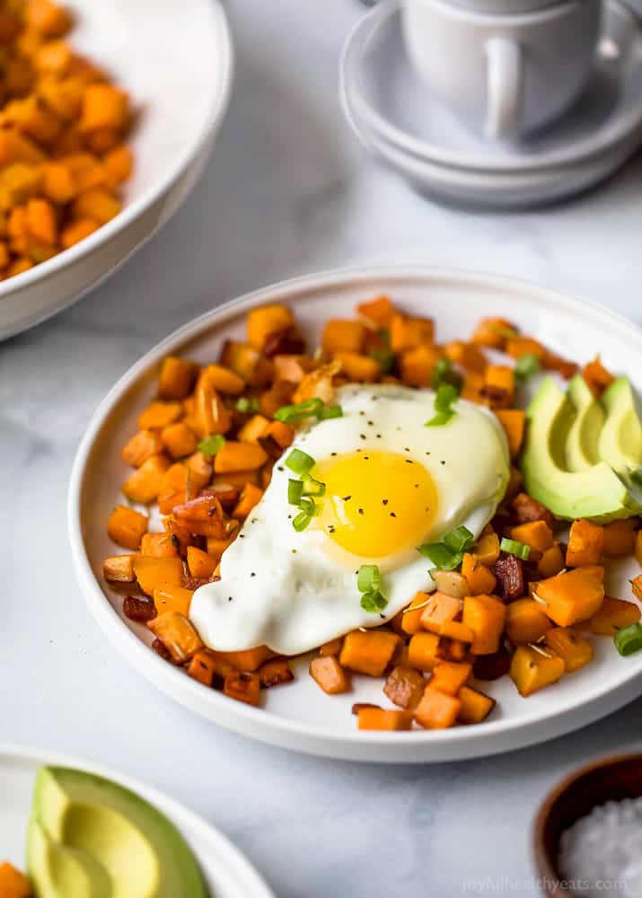 30 Minute Paleo Sweet Potato Hash & Eggs with bacon and avocado. A quick easy breakfast hash that's under 350 calories and so delicious you'll want to devour it!