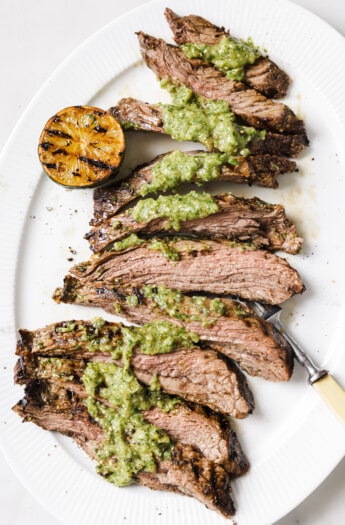 Grilled carne asada recipe with salsa verde on top.