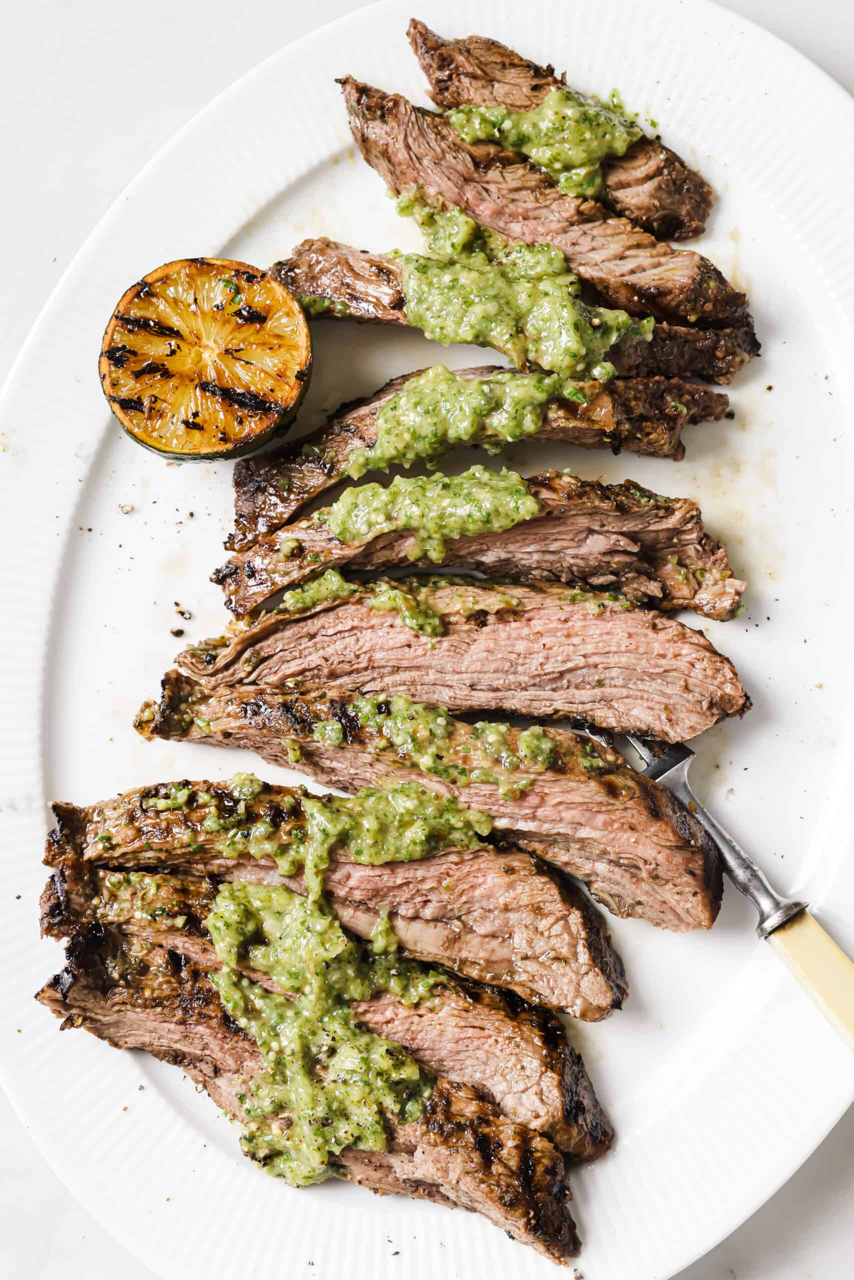 Grilled carne asada recipe with salsa verde on top. 