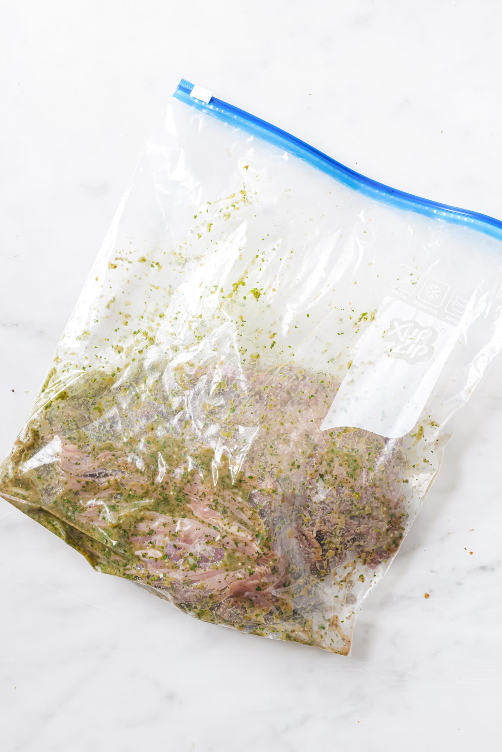 This easy carne asada recipe with salsa verde will be your new favorite Mexican dinner. Easy to make and super juicy, it's the perfect dish! Marinading the steak.