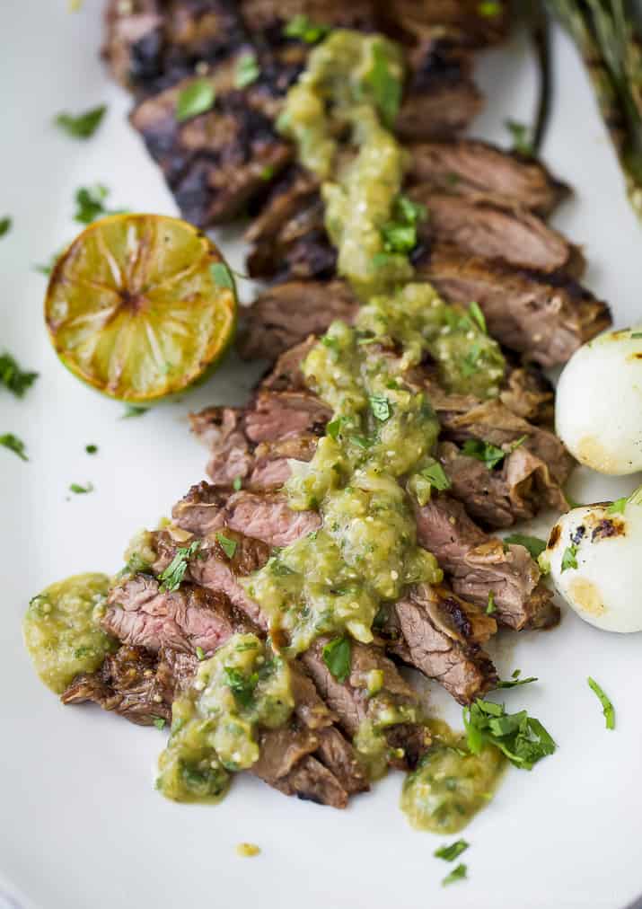 Tender grilled Carne Asada that's marinaded in a homemade Salsa Verde then charred to perfection for one authentic mexican dish! This flavorful low carb Carne Asada will be a hit at your house! Great for a weeknight dinner or dinner parties! #paleo #glutenfree