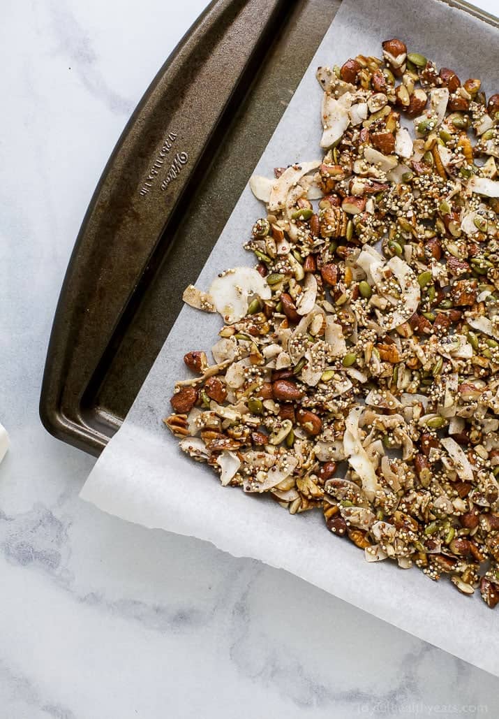 Simple Gluten Free Granola made with nuts, quinoa and toasted coconut. This homemade granola is refined sugar free and loaded with tasty goodness. It's makes the perfect start to your day or mid-day snack!