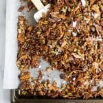 Simple Gluten Free Granola made with nuts, quinoa and toasted coconut. This homemade granola is refined sugar free and loaded with tasty goodness. It's makes the perfect start to your day or mid-day snack!