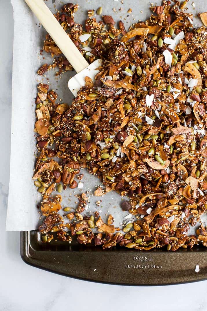 Simple Gluten Free Granola made with nuts, quinoa and toasted coconut. This homemade granola is refined sugar free and loaded with tasty goodness. It's makes the perfect start to your day or mid-day snack!