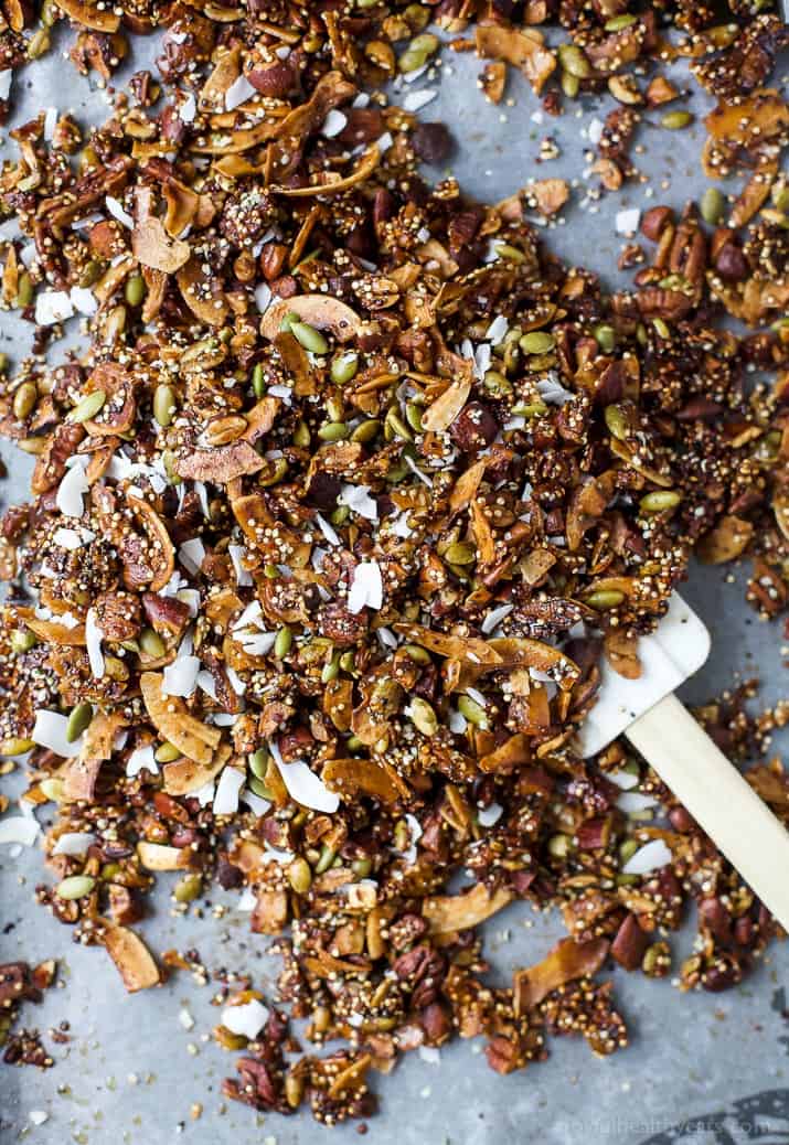 Simple Gluten Free Granola made with nuts, quinoa and toasted coconut. This homemade granola is refined sugar free and loaded with tasty goodness. It's makes the perfect start to your day or mid-day snack!