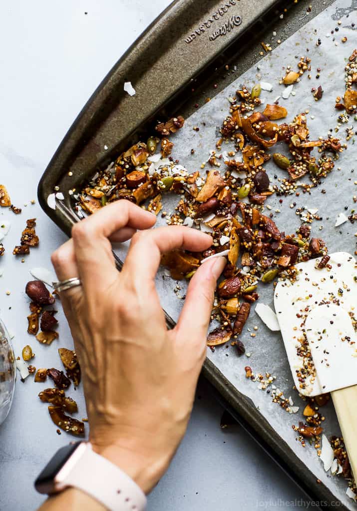 Simple Gluten Free Granola made with nuts, quinoa and toasted coconut. This homemade granola is refined sugar free and loaded with tasty goodness. It's makes the perfect start to your day or mid-day snack!