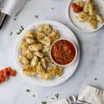 These fun Gluten Free Baked Chicken Parmesan Bites served with a homemade marinara sauce make the perfect kids school lunch, game day appetizer or quick dinner recipe! Easy, light and full of flavor - these chicken bites are a must make! #ad