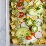 These Chicken Enchiladas smothered in a Poblano Cream Sauce will quickly become a family favorite. If you're looking for a flavorful recipe these Chicken Enchiladas are it - they're the ultimate healthy Taco Tuesday meal!