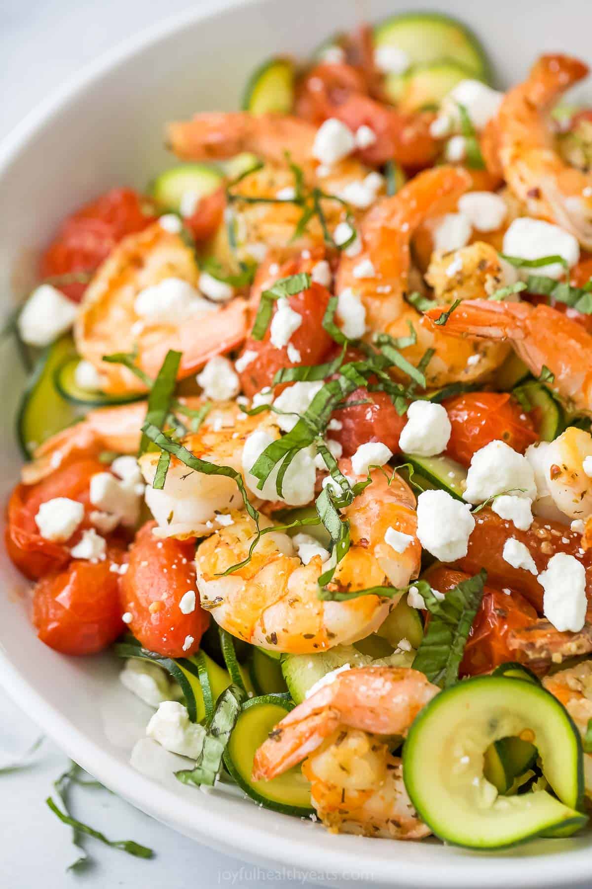 Close-up of zoodle pasta with veggies. 