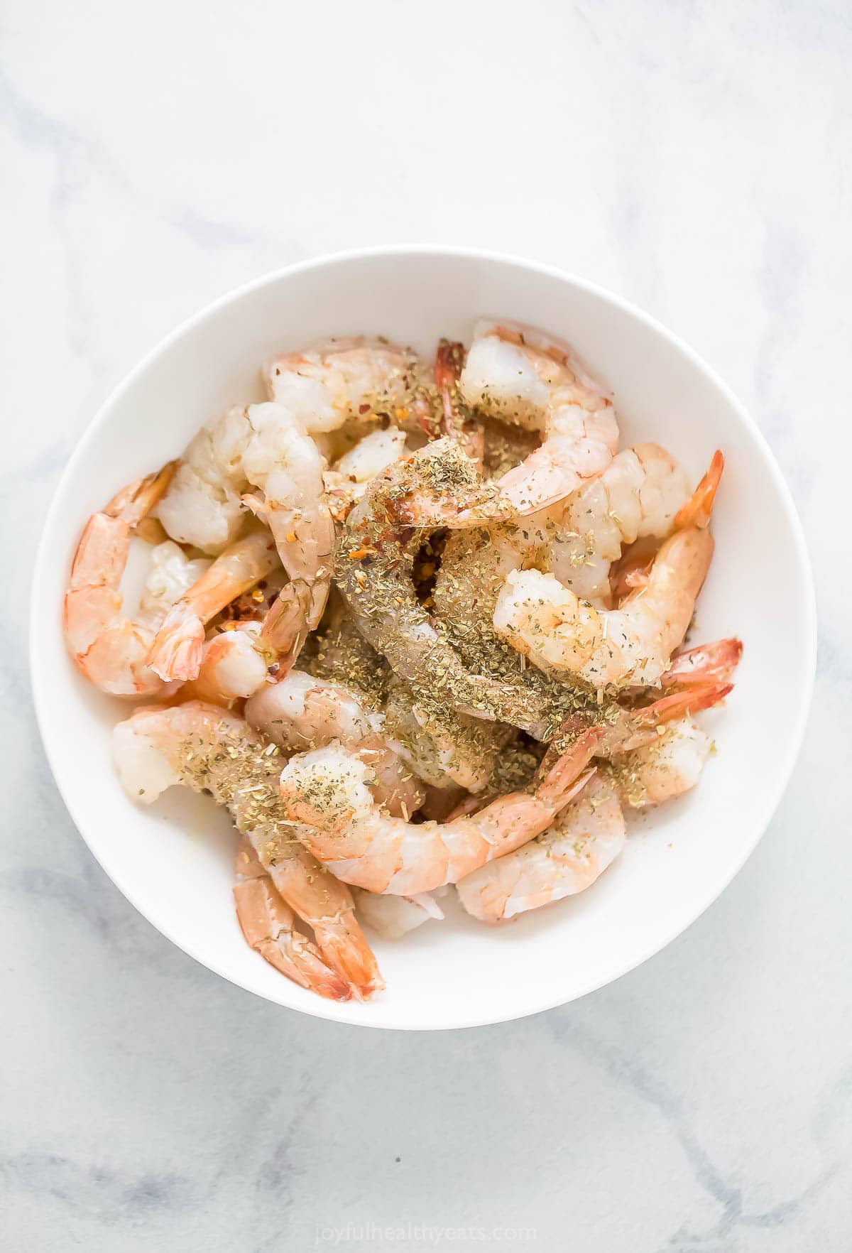 Seasoned shrimp in a bowl. 