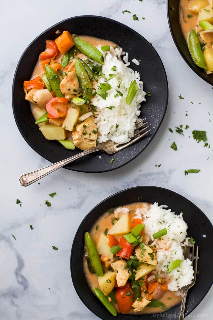 Top view of two bowls of Chicken Curry with white rice