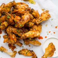 Low Carb Honey Sriracha Baked Chicken Wings, crispy delicious wings baked in the oven then covered with a sweet 'n spicy honey sriracha sauce. These Chicken Wings make the perfect game day appetizer!