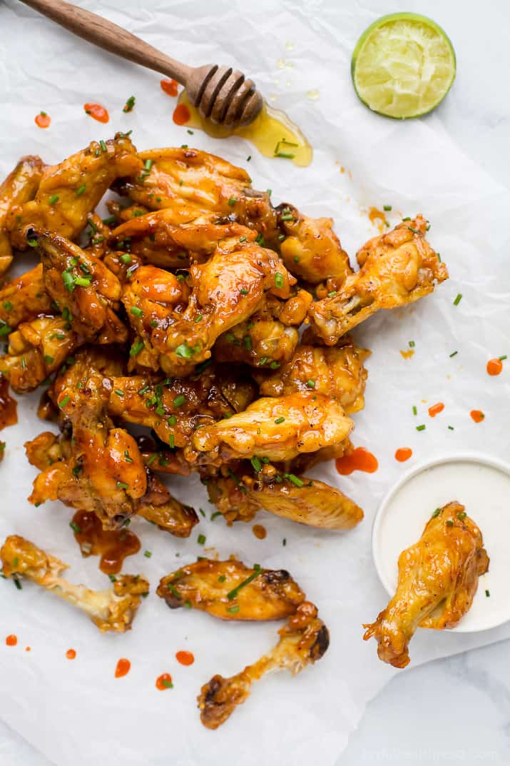 overhead photo of honey sriracha baked chicken wings with ranch