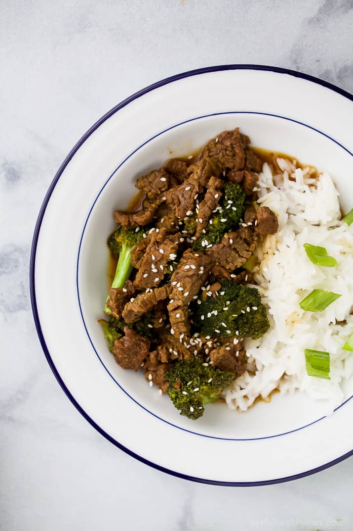 Top view of Mongolian Beef with white rice in a bowl