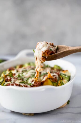 Low Carb Zucchini Lasagna Roll Ups with a homemade Meat Sauce - the perfect healthy comfort food! A ricotta filling wrapped up with zucchini noodles then topped with sauce and more cheese for one delicious bite!