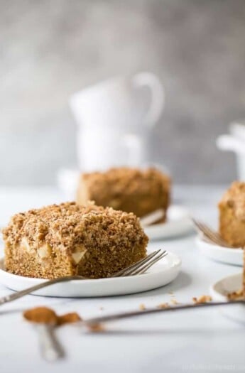 A slice of apple cinnamon coffee cake with chunks of Granny Smith apple.