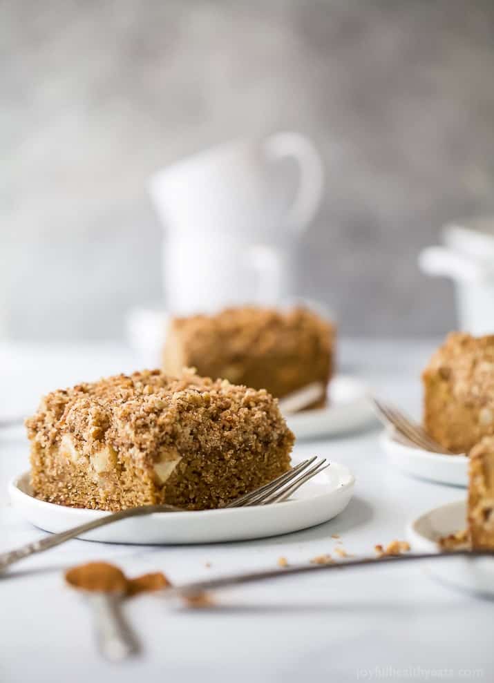 A moist Apple Cinnamon Coffee Cake that screams fall baking! Made with whole wheat flour, filled with bold cinnamon flavor, tender chunks of apple and a crumbly nut topping that you'll want to fight over. Perfect for breakfast or dessert this holiday season!