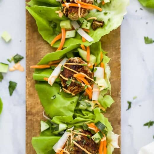 Quick Easy Banh Mi Lettuce Wraps a healthy low carb version of the famous Banh Mi Sandwich! Asian inspired turkey meatballs served on a lettuce wrap with pickled vegetables and sriracha mayo! It's dinner perfection! #glutenfree