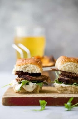Beer Braised Slow Cooker Brisket Sliders tender moist brisket served on Hawaiian rolls then slathered with a creamy horseradish aioli. This easy flavorful appetizer is sure to be devoured as soon as it hits the table!