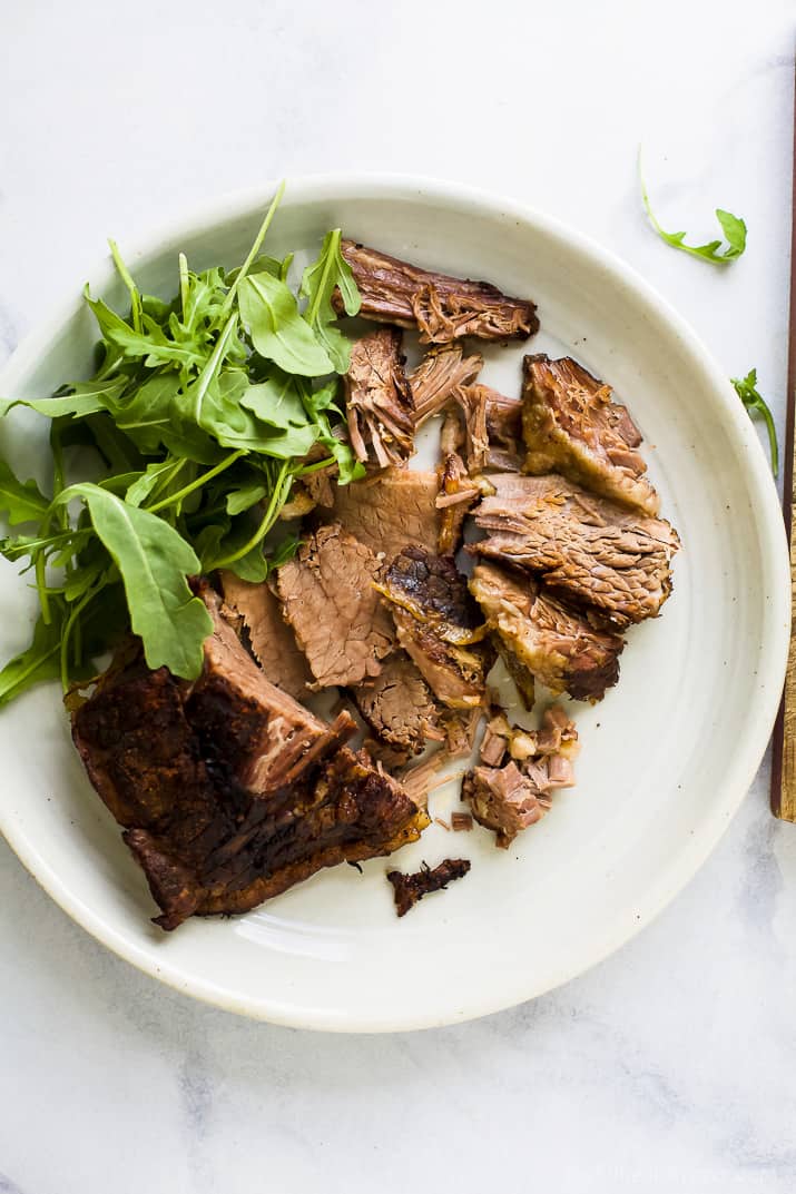 Beer Braised Slow Cooker Brisket Sliders tender moist brisket served on Hawaiian rolls then slathered with a creamy horseradish aioli. This easy flavorful appetizer is sure to be devoured as soon as it hits the table!