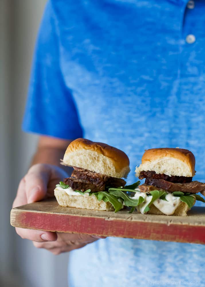 Beer Braised Slow Cooker Brisket Sliders tender moist brisket served on Hawaiian rolls then slathered with a creamy horseradish aioli. This easy flavorful appetizer is sure to be devoured as soon as it hits the table!