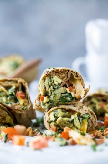 Freezer Bacon & Egg Breakfast Burritos an easy make a head breakfast that's in high protein and under 300 calories a serving. These Breakfast Burritos are a must if you're into meal prep!