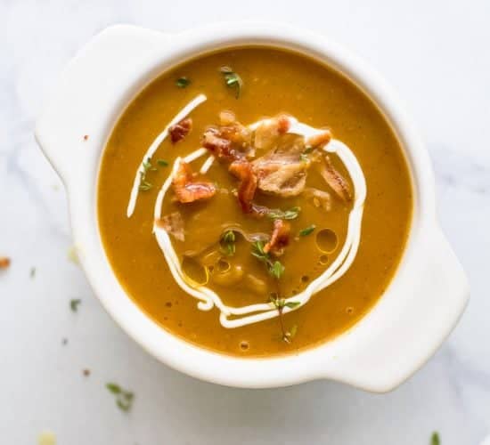 Paleo Instant Pot Autumn Squash Soup, filled with butternut squash, acorn squash, tummy warming spices and topped with bacon. An easy creamy squash soup that's guaranteed to be the star of the fall! #glutenfree