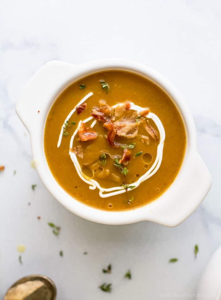 Paleo Instant Pot Autumn Squash Soup, filled with butternut squash, acorn squash, tummy warming spices and topped with bacon. An easy creamy squash soup that's guaranteed to be the star of the fall! #glutenfree
