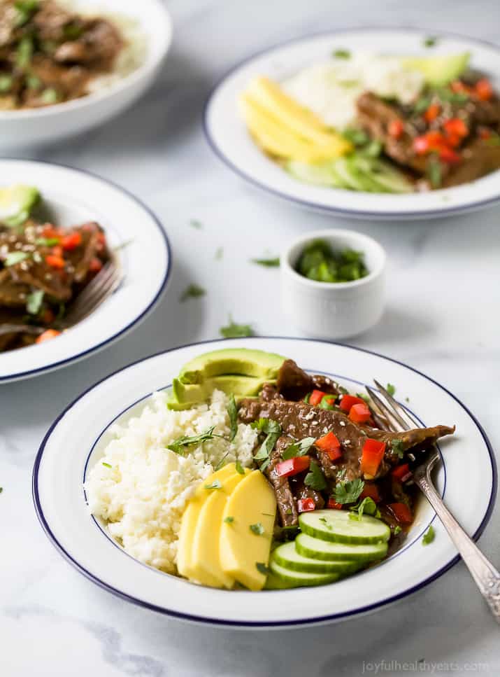 Top view of Instant Pot Korean Beef Bowl on a bed of cauliflower rice with mango and avocado