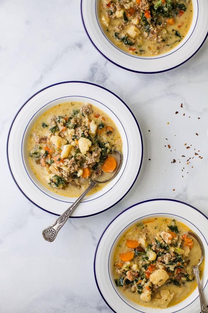 Instant Pot Zuppa Toscana Soup loaded with sausage, bacon, cauliflower and kale. This Zuppa Toscana recipe is low carb, dairy free, paleo and keto! It's an Olive Garden Copycat recipe that's guaranteed to be a hit!