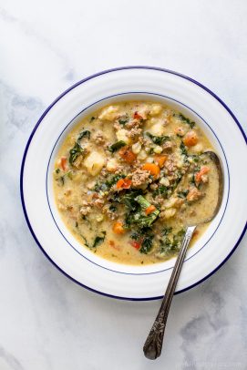 Instant Pot Zuppa Toscana Soup loaded with spicy sausage flavor, bacon, cauliflower and kale. This Zuppa Toscana recipe is low carb, dairy free, paleo and keto! It's an Olive Garden Copycat recipe that's guaranteed to be a hit!