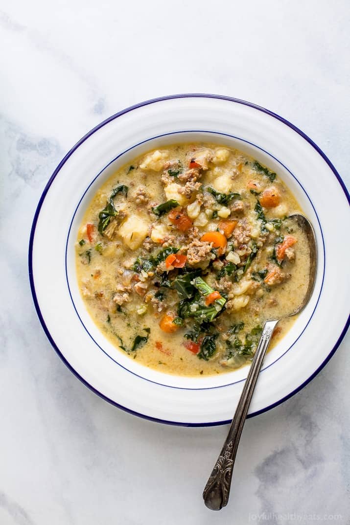 Instant Pot Zuppa Toscana Soup loaded with sausage, bacon, cauliflower and kale. This Zuppa Toscana recipe is low carb, dairy free, paleo and keto! It's an Olive Garden Copycat recipe that's guaranteed to be a hit!