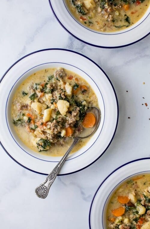 Instant Pot Zuppa Toscana Soup loaded with sausage, bacon, cauliflower and kale. This Zuppa Toscana recipe is low carb, dairy free, paleo and keto! It's an Olive Garden Copycat recipe that's guaranteed to be a hit!