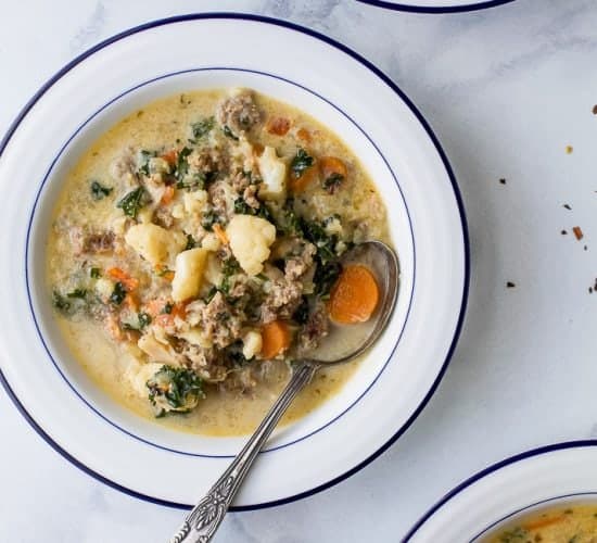 Instant Pot Zuppa Toscana Soup loaded with sausage, bacon, cauliflower and kale. This Zuppa Toscana recipe is low carb, dairy free, paleo and keto! It's an Olive Garden Copycat recipe that's guaranteed to be a hit!