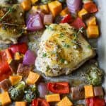 Oven Baked Honey Mustard Chicken Thighs with brussels sprouts and sweet potatoes. This Baked Chicken Thigh recipe is an easy one pan meal perfect for a quick healthy weeknight dinner. #paleo #glutenfree