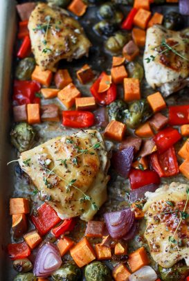 Oven Baked Honey Mustard Chicken Thighs with brussels sprouts and sweet potatoes. This Baked Chicken Thigh recipe is an easy one pan meal perfect for a quick healthy weeknight dinner. #paleo #glutenfree