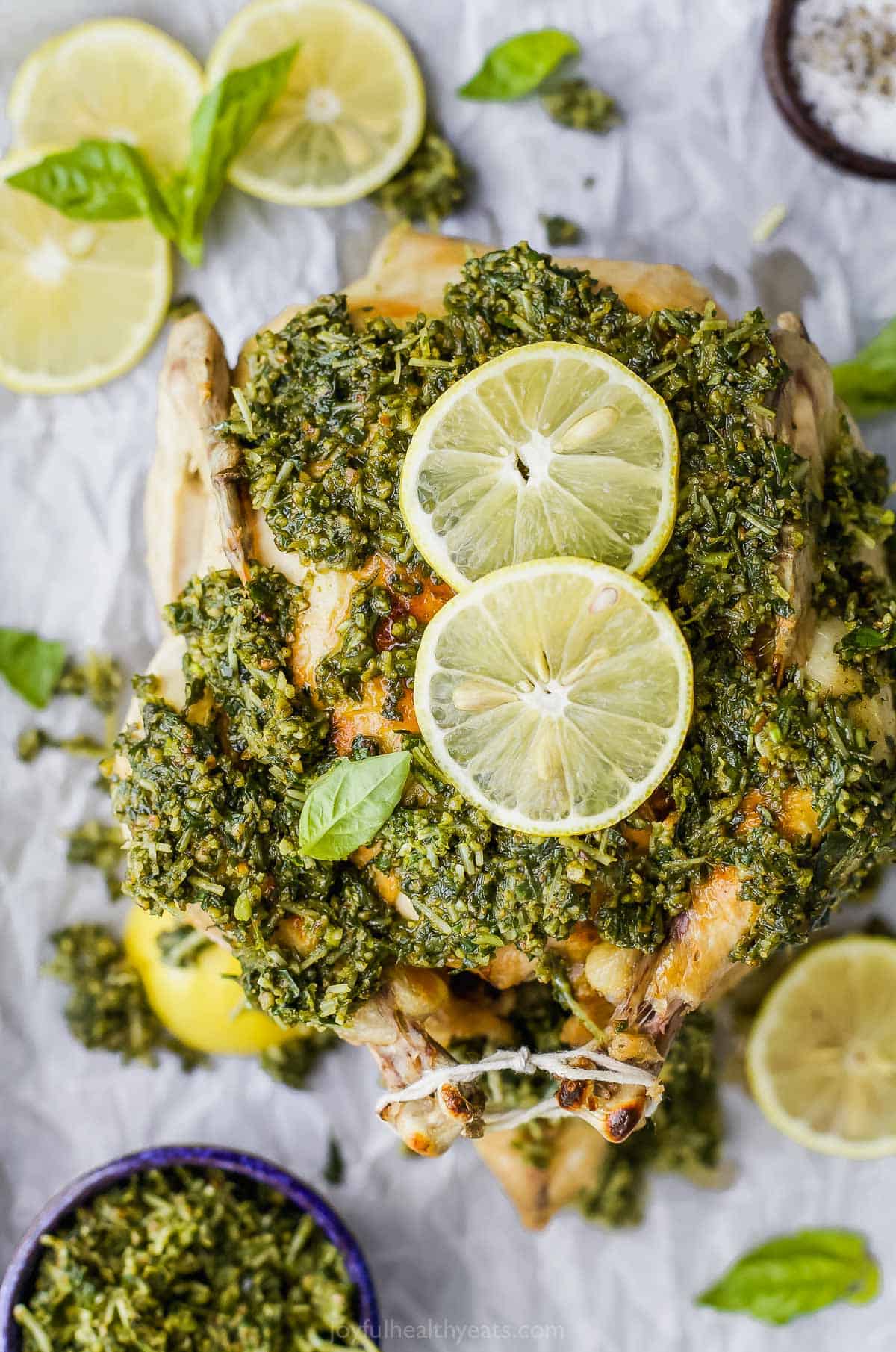 overhead picture of rotisserie chicken with pesto sauce