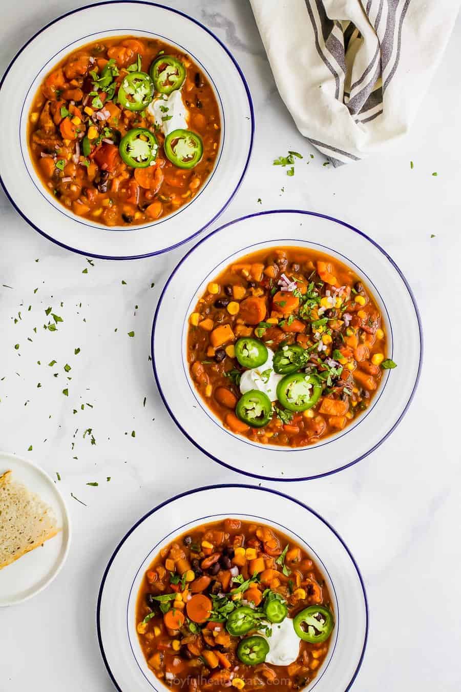 Bowls of instant pot sweet potato black bean chili. 