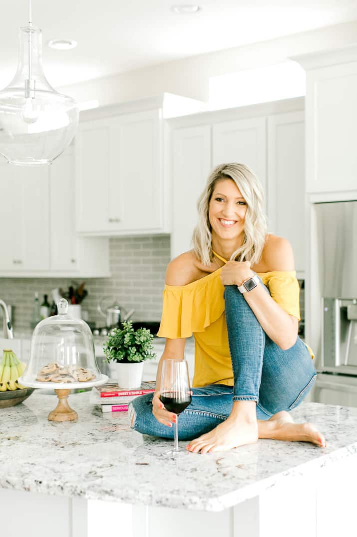 Krista sitting on her kitchen counter