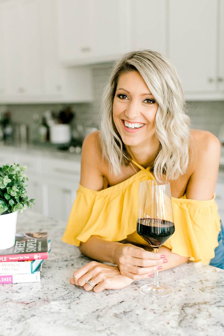 Krista Rollins with a glass of red wine